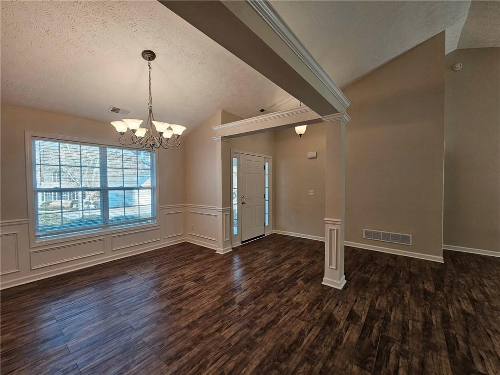 190 Berkley Drive Villa Rica, GA 30180 - Photo 9 of 38 a view of an empty room with wooden floor and a window