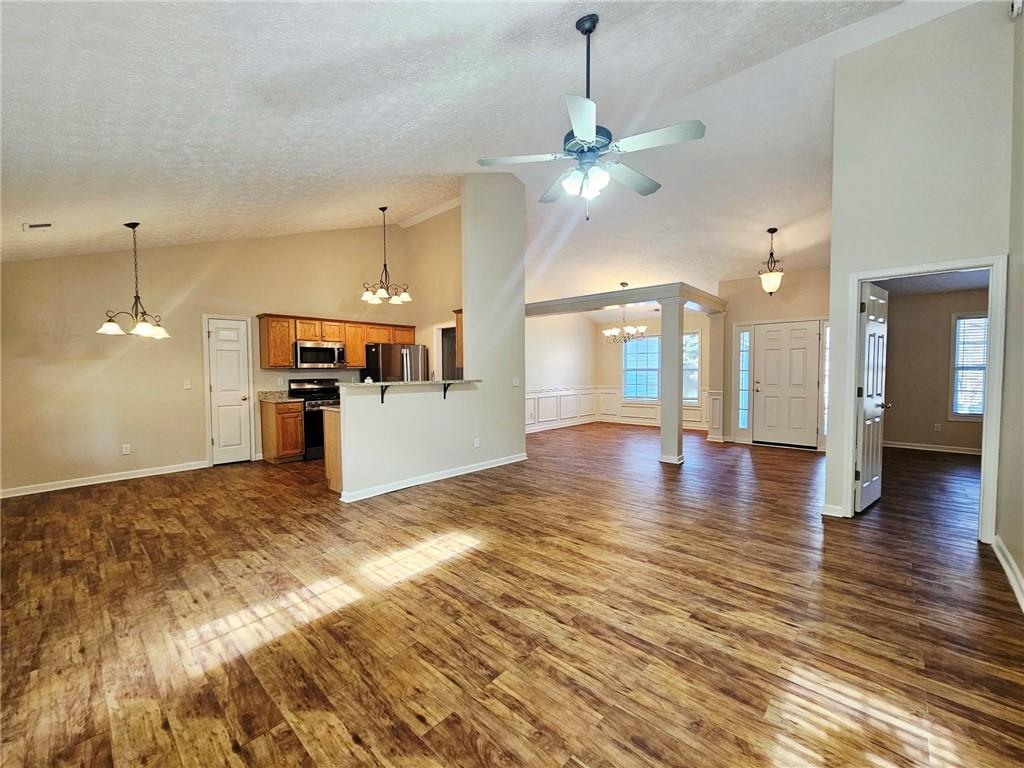 190 Berkley Drive Villa Rica, GA 30180 - Photo 10 of 38 a view of a kitchen with a stove cabinets and wooden floor