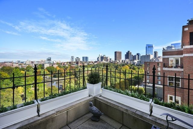 a view of a balcony with city view