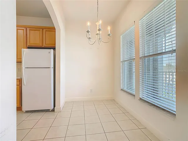 a kitchen with a sink a stove top oven and white stainless steel appliances