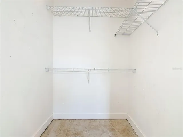 a bathroom with a double vanity sink and mirror