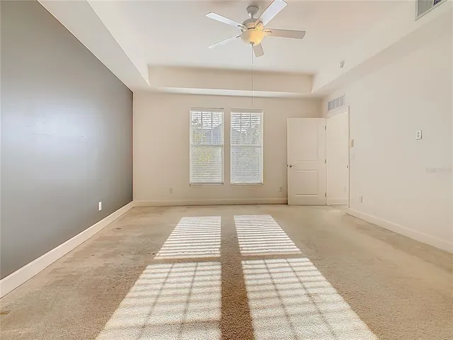 an aerial view of a house with yard