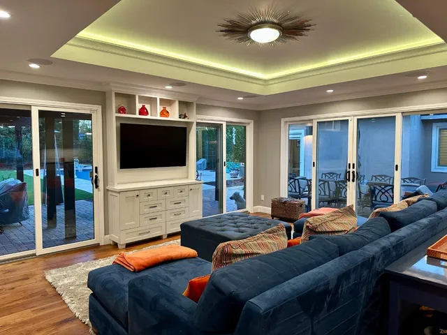 a bed sitting in a bedroom and night stand