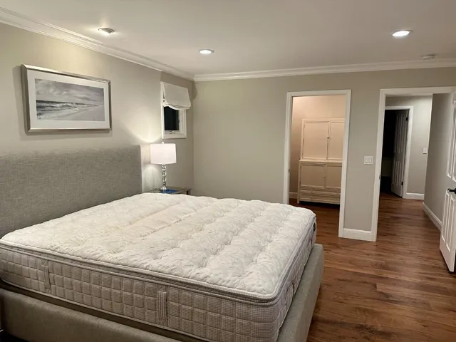 a bathroom with a sink mirror and tub