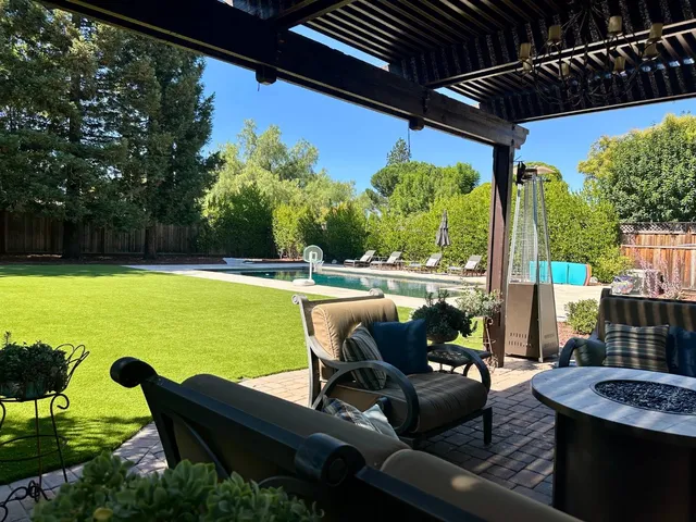 a view of a patio with swimming pool