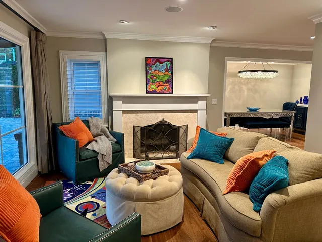 a living room with furniture and a fireplace