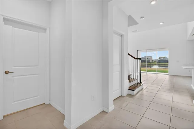 a view of empty room with ceiling fan