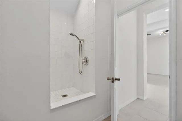 an aerial view of a house with swimming pool and garden