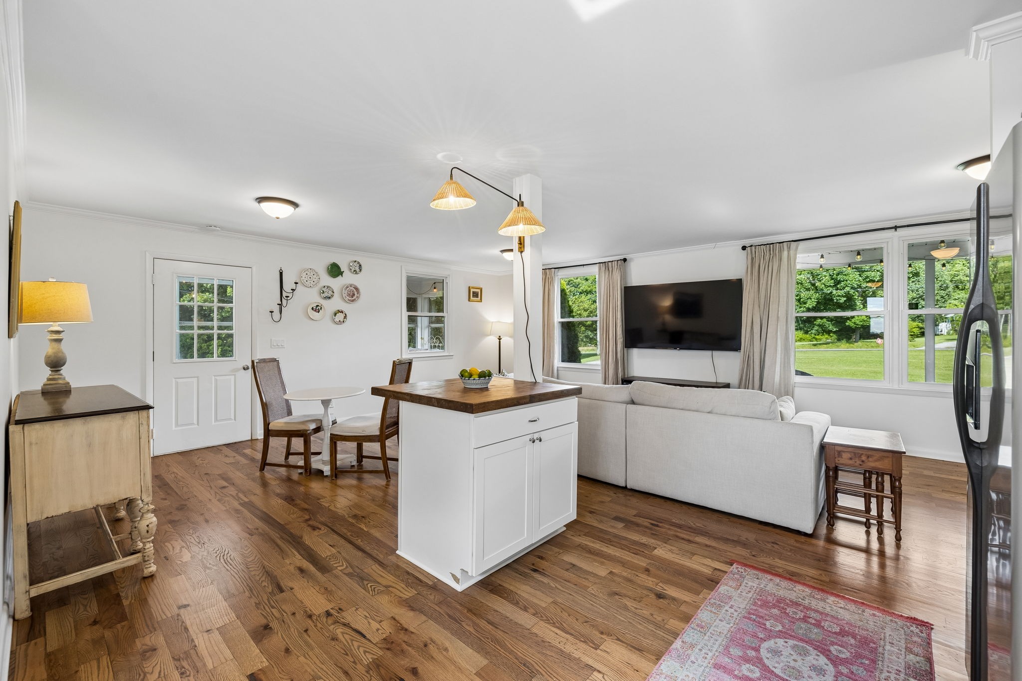 1326 Shahan Road Pleasant View, TN 37146 - Photo 14 of 41 a kitchen that has a lot of cabinets a sink and a wooden floor in it
