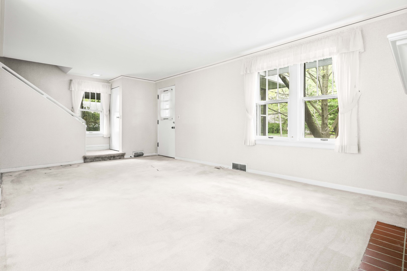 710 Normal Avenue Normal, IL 61761 - Photo 12 of 39 an empty room with windows