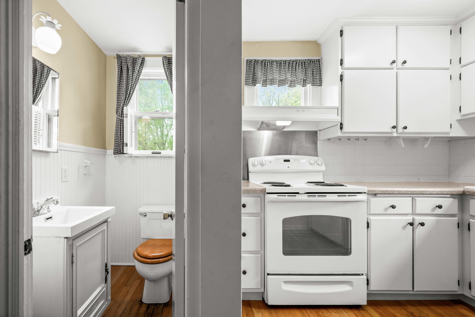 710 Normal Avenue Normal, IL 61761 - Photo 14 of 39 a kitchen with a stove a sink and a refrigerator