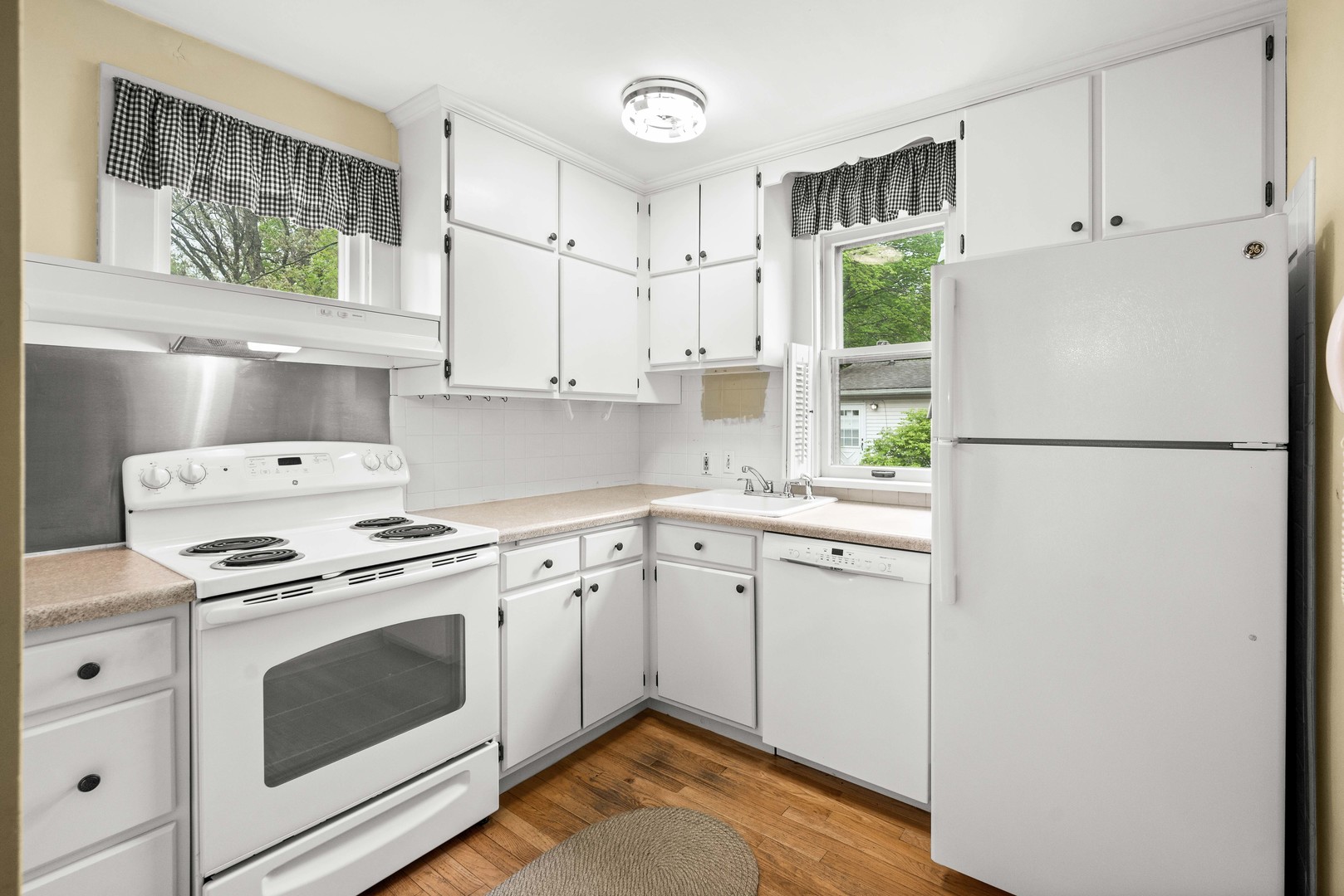 710 Normal Avenue Normal, IL 61761 - Photo 16 of 39 a kitchen with a stove a refrigerator and a sink
