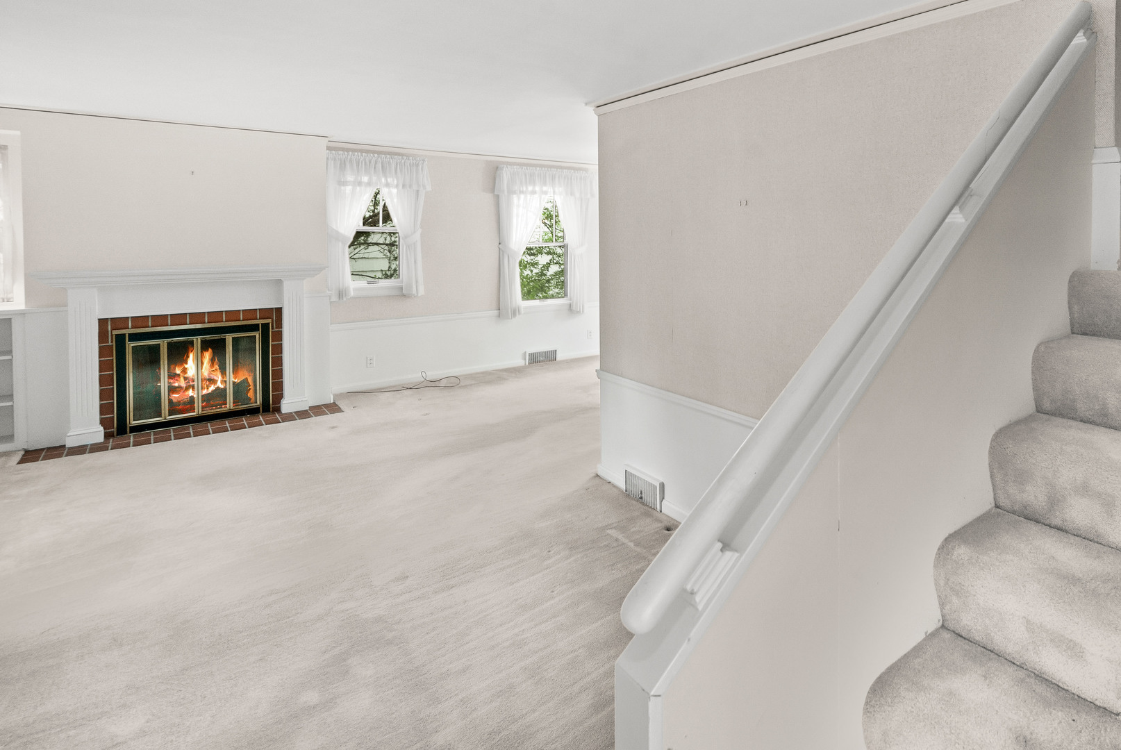 710 Normal Avenue Normal, IL 61761 - Photo 17 of 39 a view of a livingroom with an empty space and a fireplace