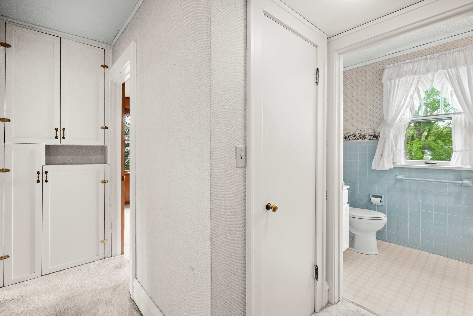 710 Normal Avenue Normal, IL 61761 - Photo 18 of 39 a bathroom with a toilet sink and a mirror