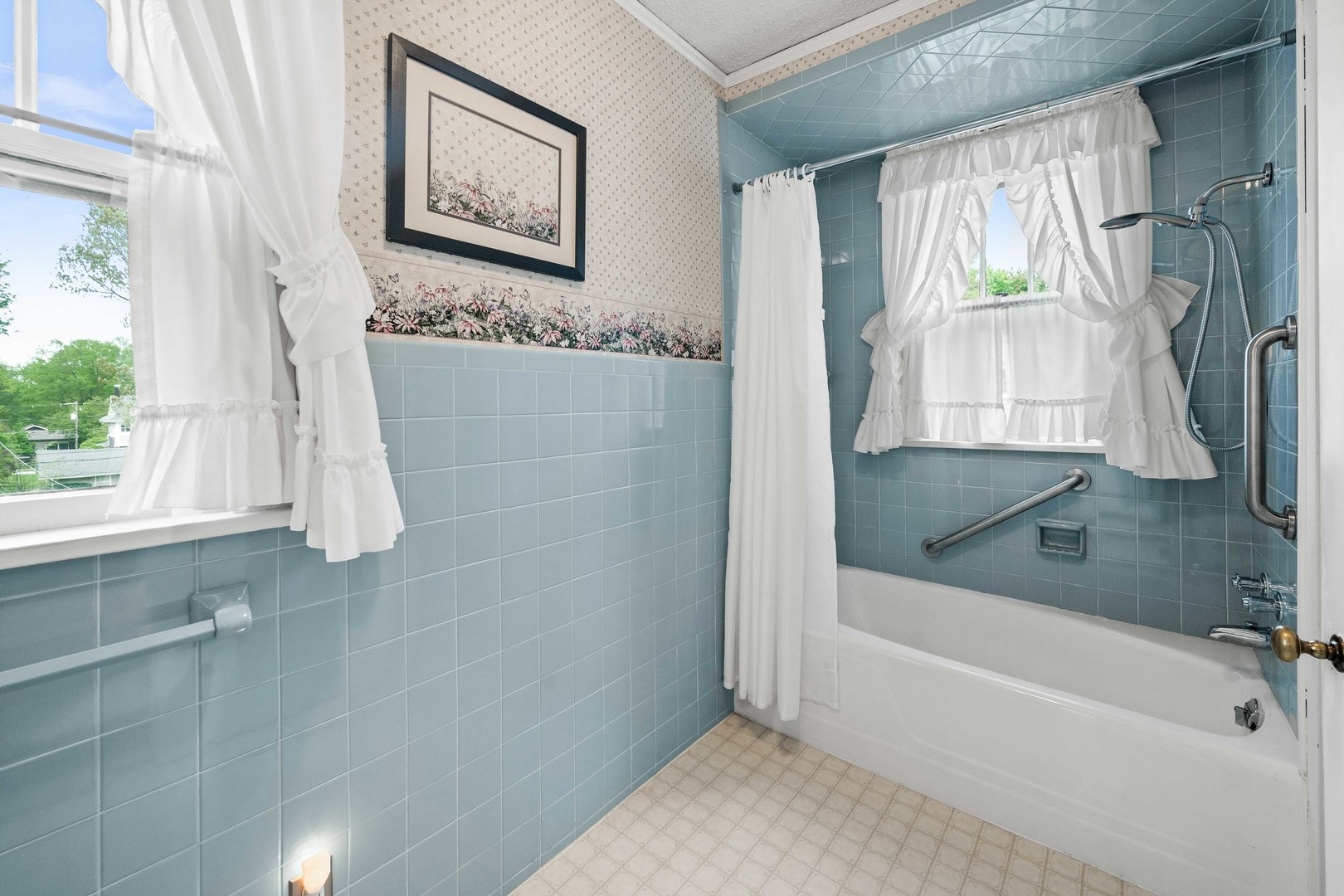 710 Normal Avenue Normal, IL 61761 - Photo 20 of 39 a bathroom with a bathtub and a shower