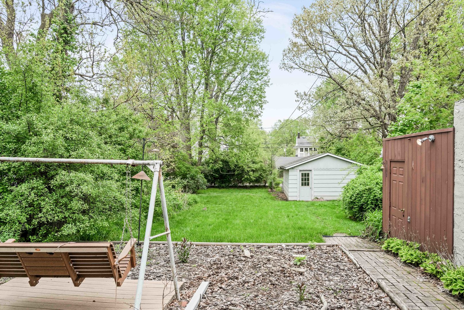 710 Normal Avenue Normal, IL 61761 - Photo 35 of 39 a view of a deck with a chair and floor to ceiling window