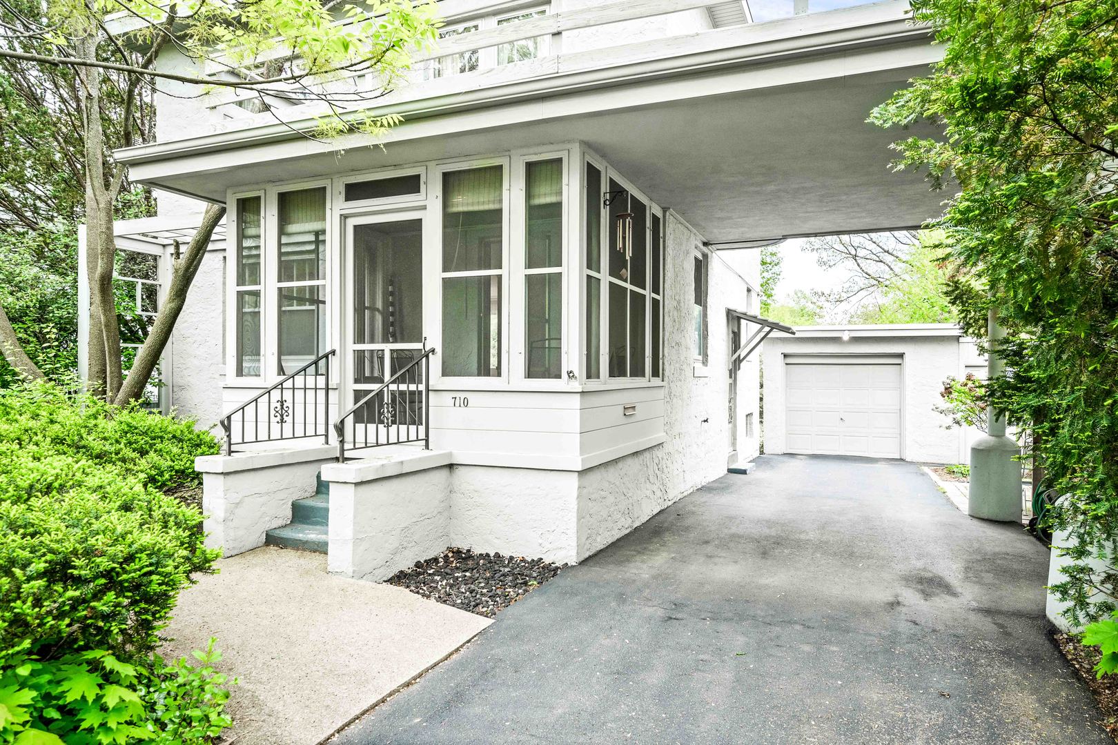 710 Normal Avenue Normal, IL 61761 - Photo 5 of 39 front view of a house with a large window and potted plants