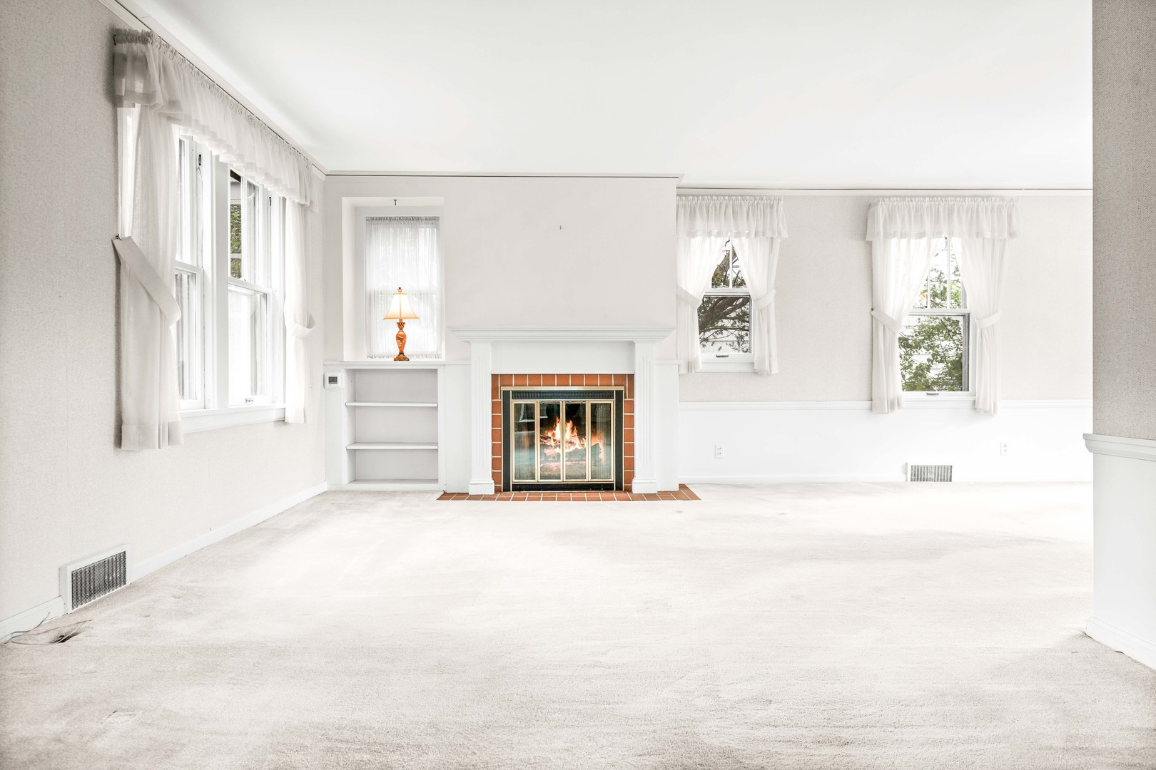 710 Normal Avenue Normal, IL 61761 - Photo 9 of 39 a big room with windows and a fireplace