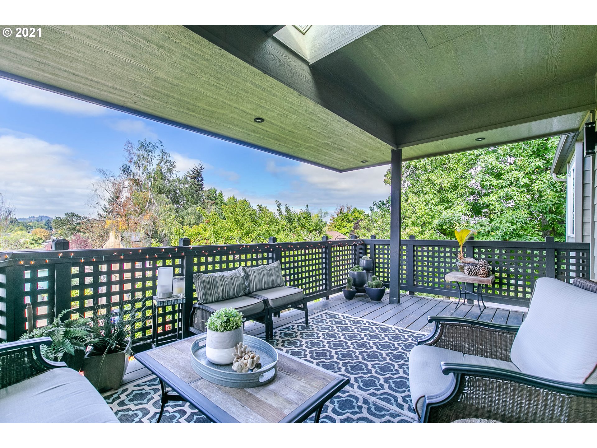 923 Prescott Lane Springfield, OR 97477 - Photo 12 of 32 a view of a patio with a table chairs and a backyard