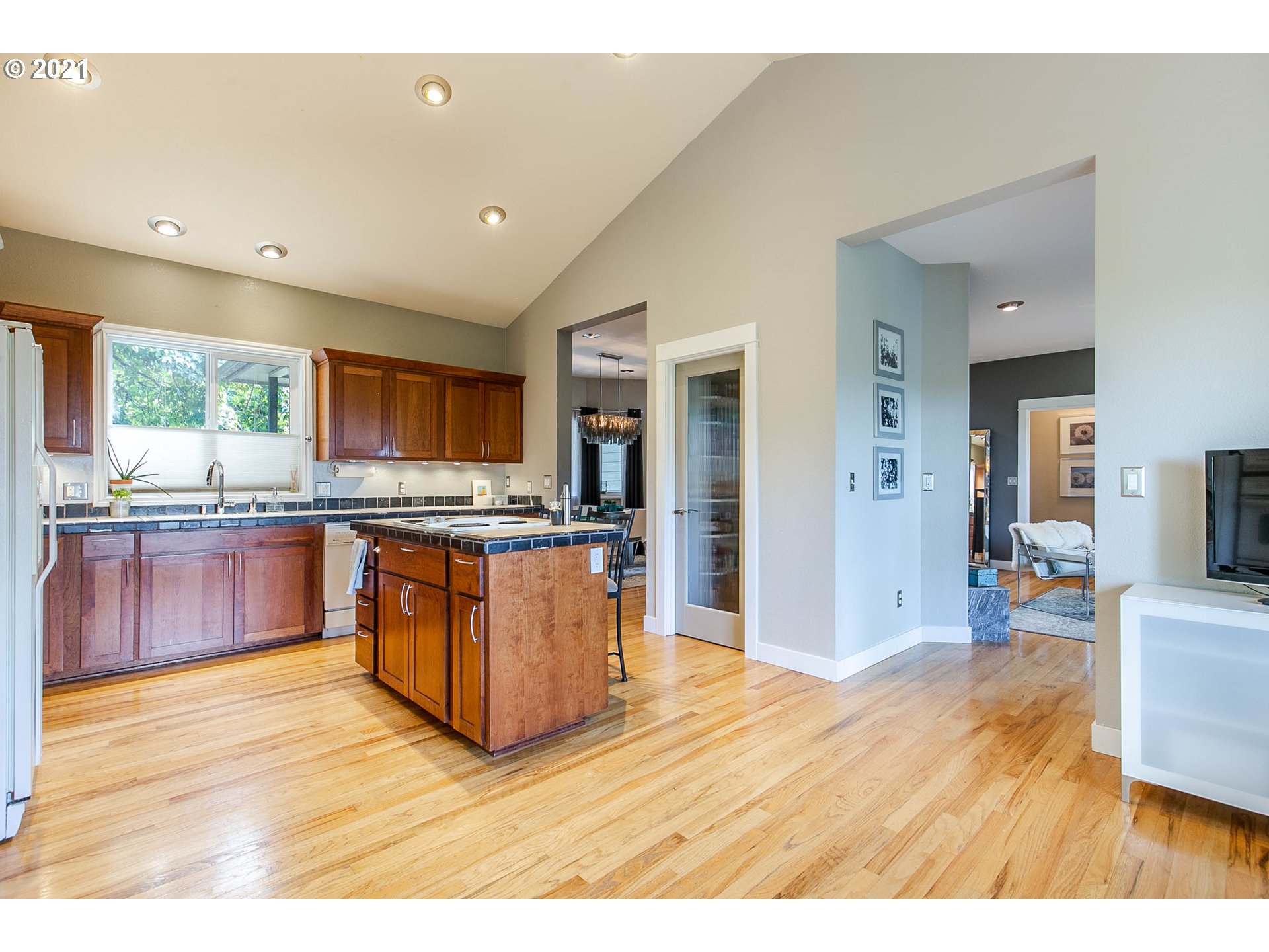 923 Prescott Lane Springfield, OR 97477 - Photo 14 of 32 a large kitchen with stainless steel appliances kitchen island granite countertop a large counter top and a stove