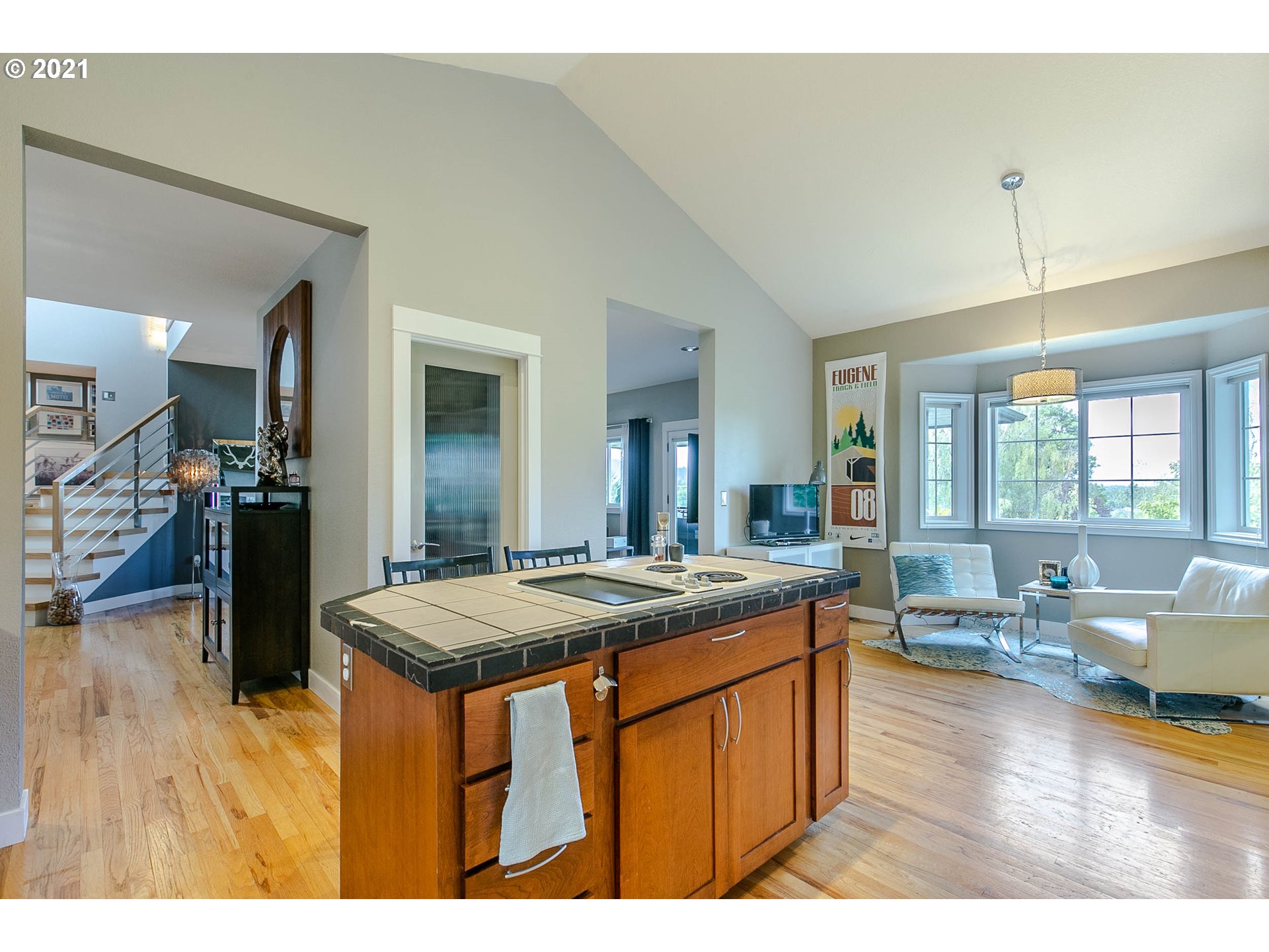 923 Prescott Lane Springfield, OR 97477 - Photo 16 of 32 a dining hall with stainless steel appliances granite countertop a kitchen island a stove and a sink