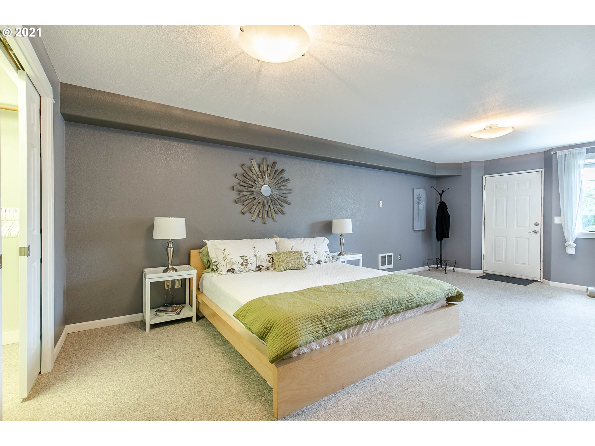 923 Prescott Lane Springfield, OR 97477 - Photo 29 of 32 a bedroom with a bed and a chandelier