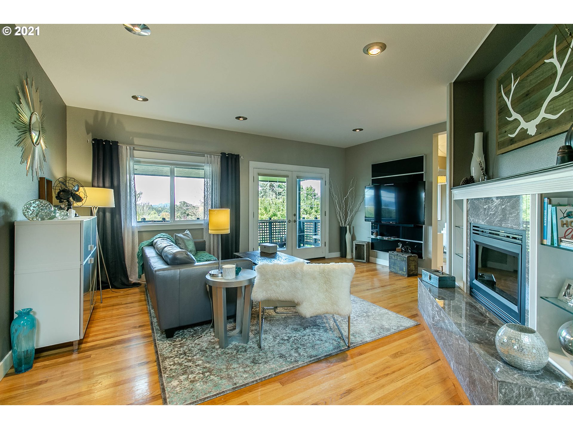 923 Prescott Lane Springfield, OR 97477 - Photo 6 of 32 a living room with fireplace furniture and a flat screen tv