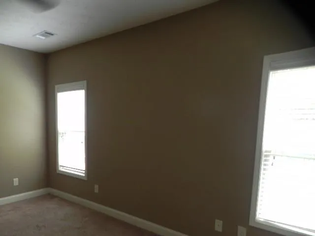 a view of outdoor space with wooden fence