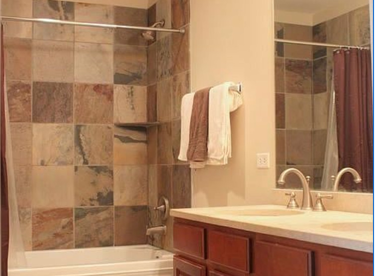 828 West Grace Street, Unit 508 Chicago, IL 60613 - Photo 11 of 15 a bathroom with a sink and a shower