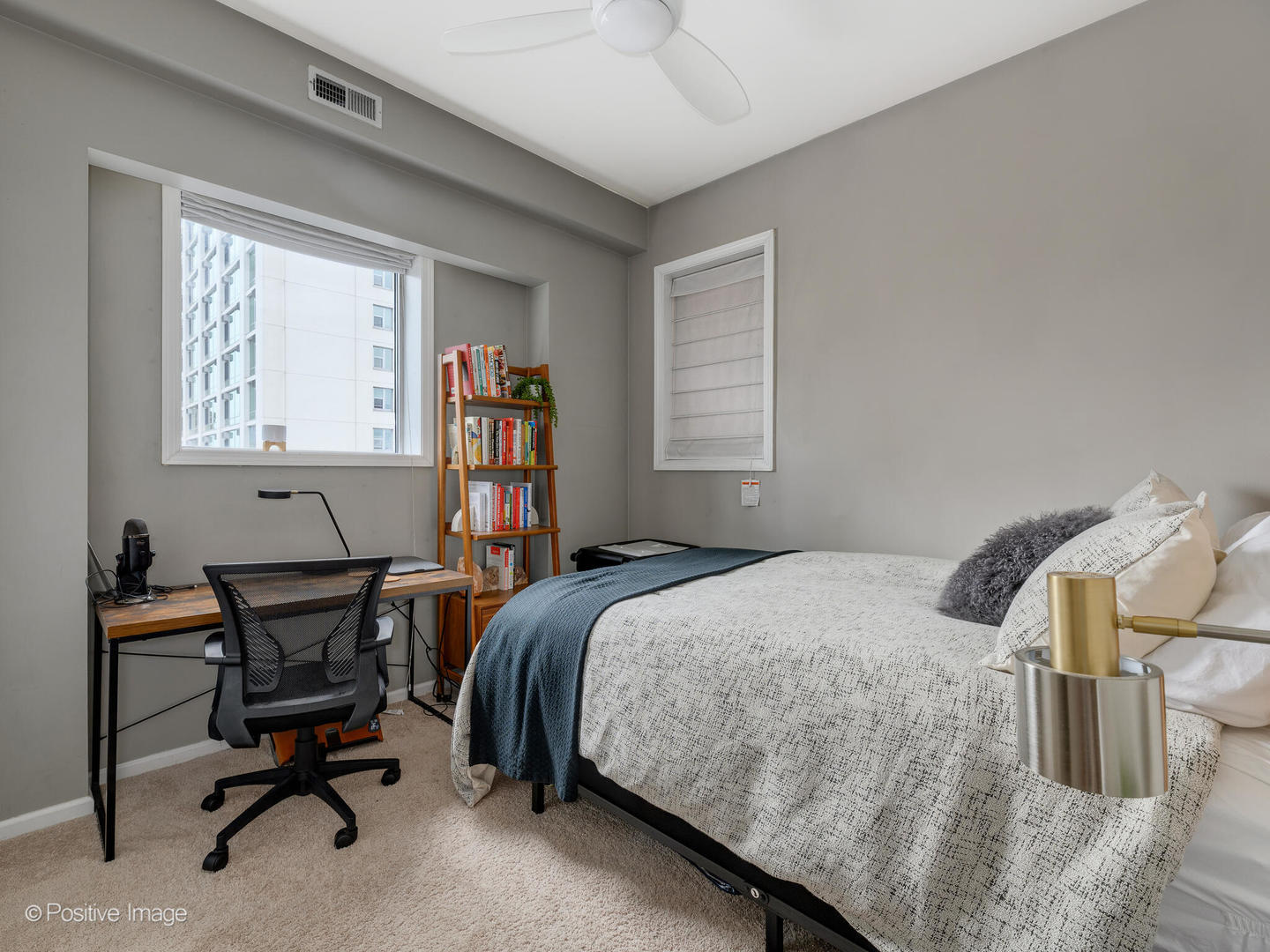 828 West Grace Street, Unit 508 Chicago, IL 60613 - Photo 13 of 15 a bed room with a bed and a desk