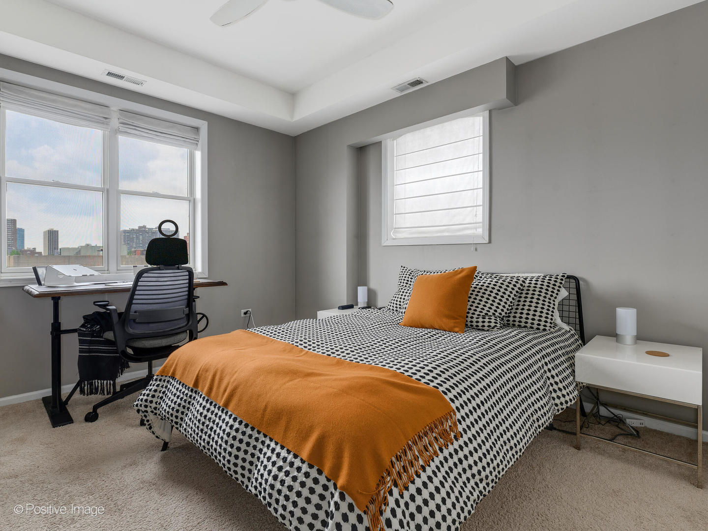 828 West Grace Street, Unit 508 Chicago, IL 60613 - Photo 10 of 15 a bedroom with a bed and wooden floor