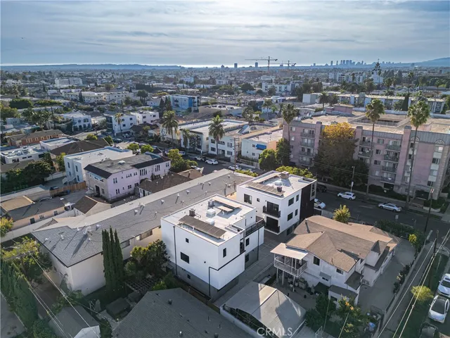 an aerial view of a city with lots of residential buildings