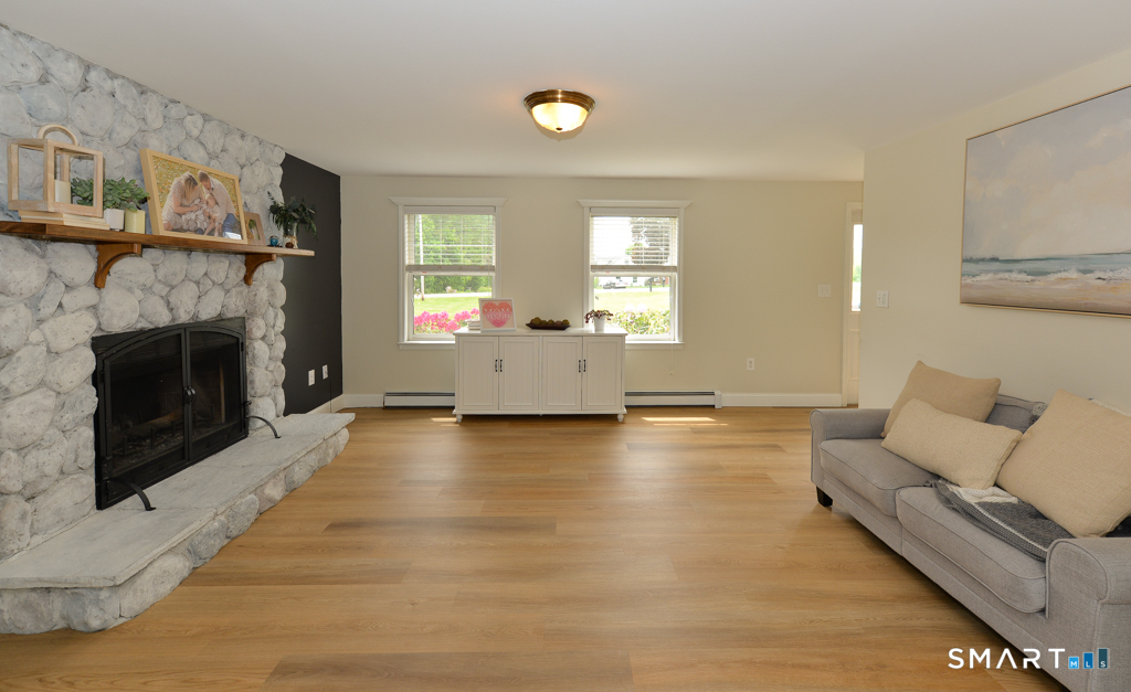109 Harrison Lane Bethlehem, CT 06751 - Photo 5 of 28 a living room with furniture and a fireplace
