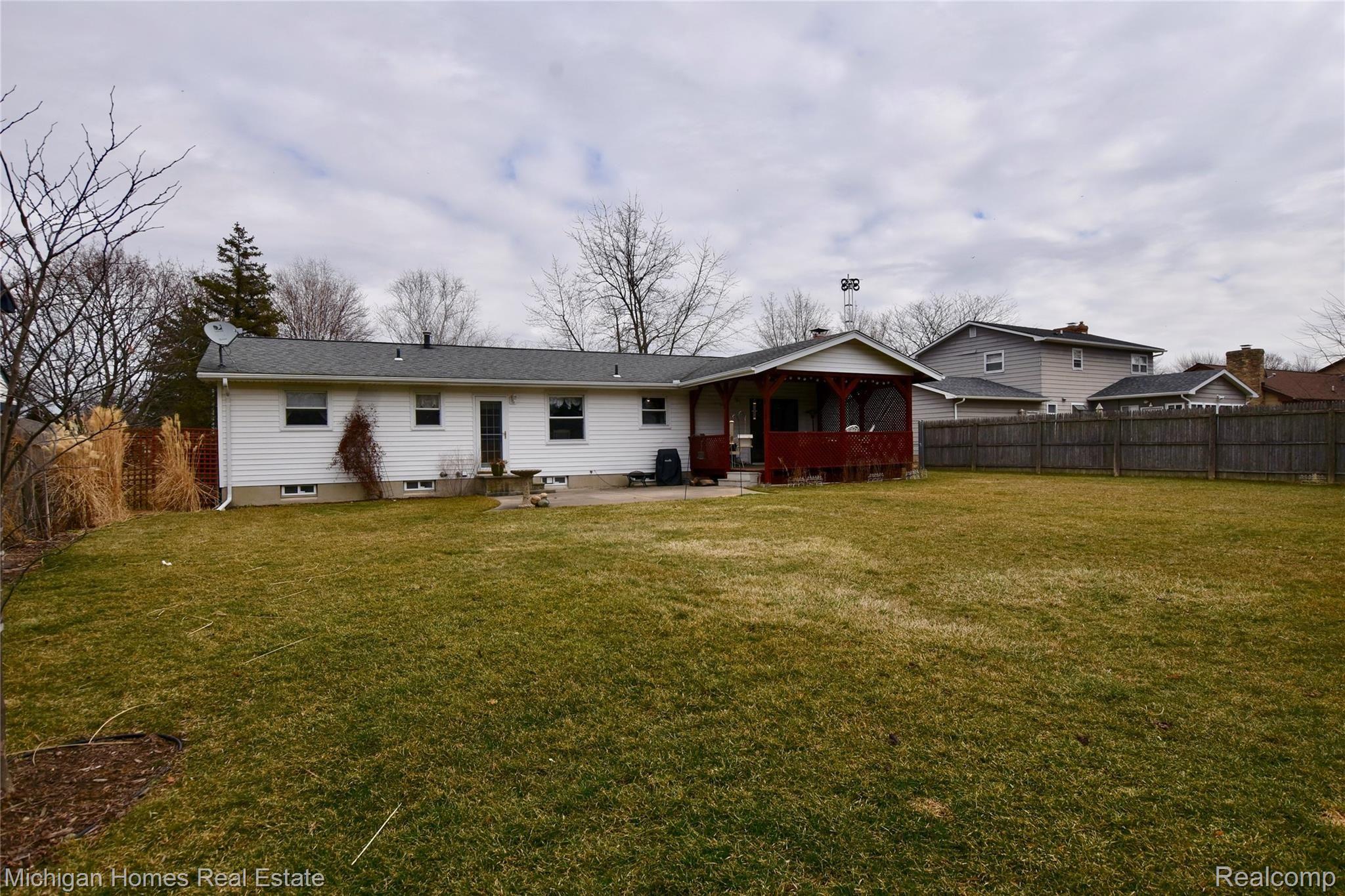 5385 Old Franklin Road Grand Blanc, MI 48439 - Photo 29 of 30 Covered deck and concrete patio ~ large fenced backyard with beautiful perinnials and large storage shed