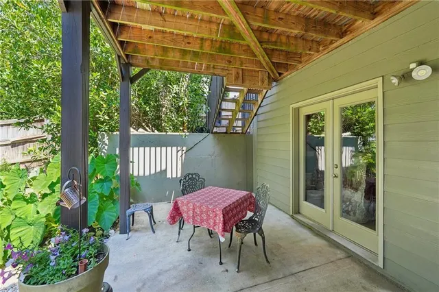 a view of a chair and table in the balcony