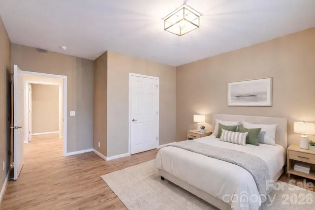 a big room with wooden floor and windows