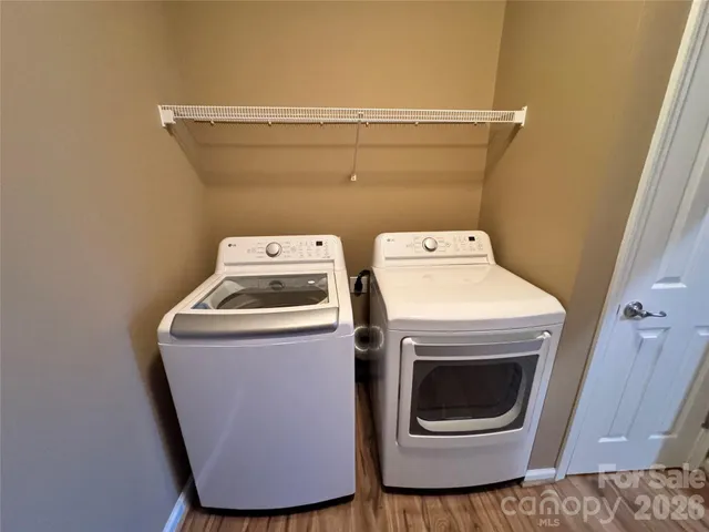 a view of a building with a street and car parked