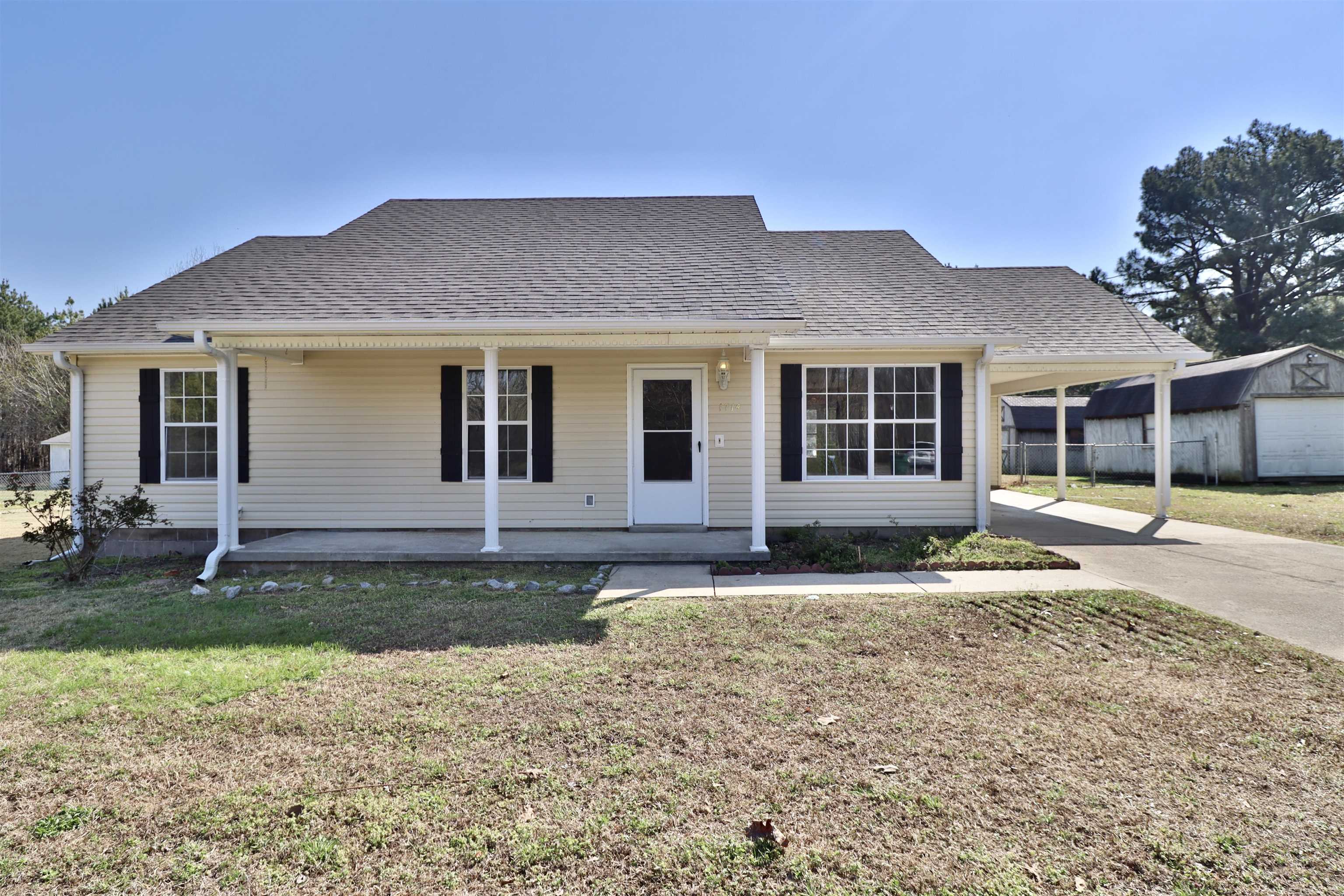 1714 Conner Whitefield Road Ripley, TN 38063 - Photo 1 of 37 a front view of a house with garden