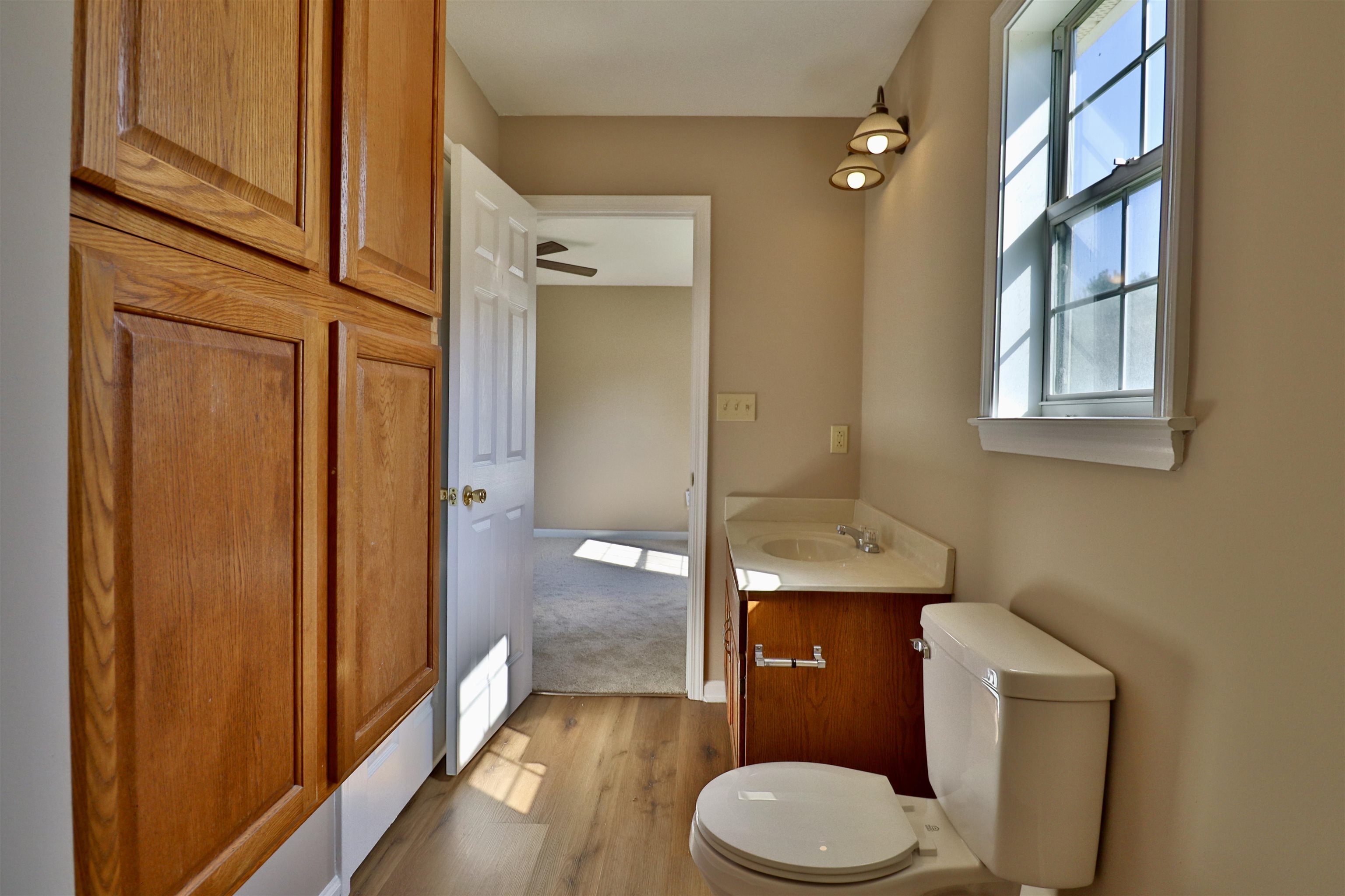 1714 Conner Whitefield Road Ripley, TN 38063 - Photo 13 of 37 a bathroom with a toilet a sink and mirror