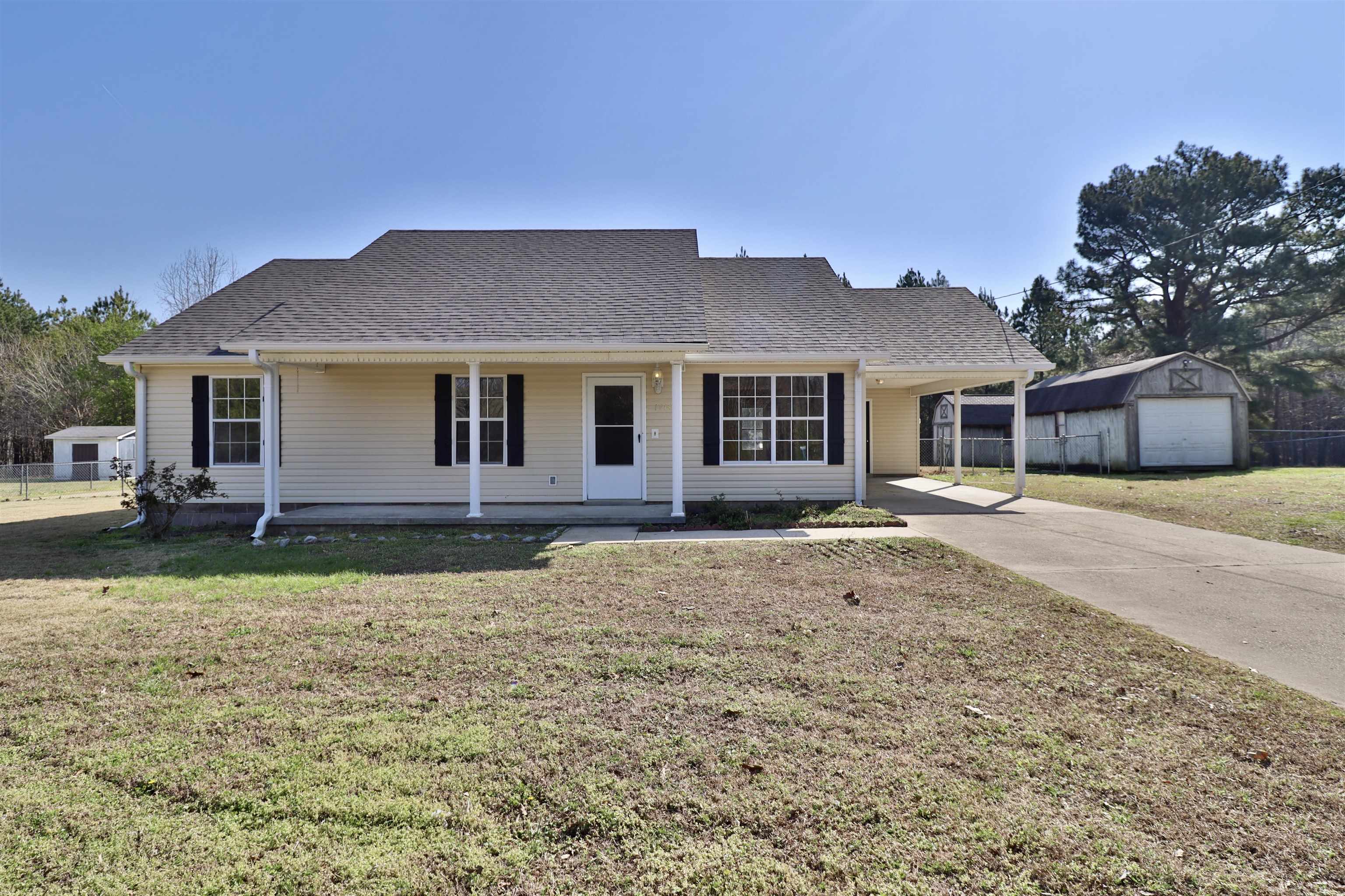 1714 Conner Whitefield Road Ripley, TN 38063 - Photo 21 of 37 a front view of a house with a yard