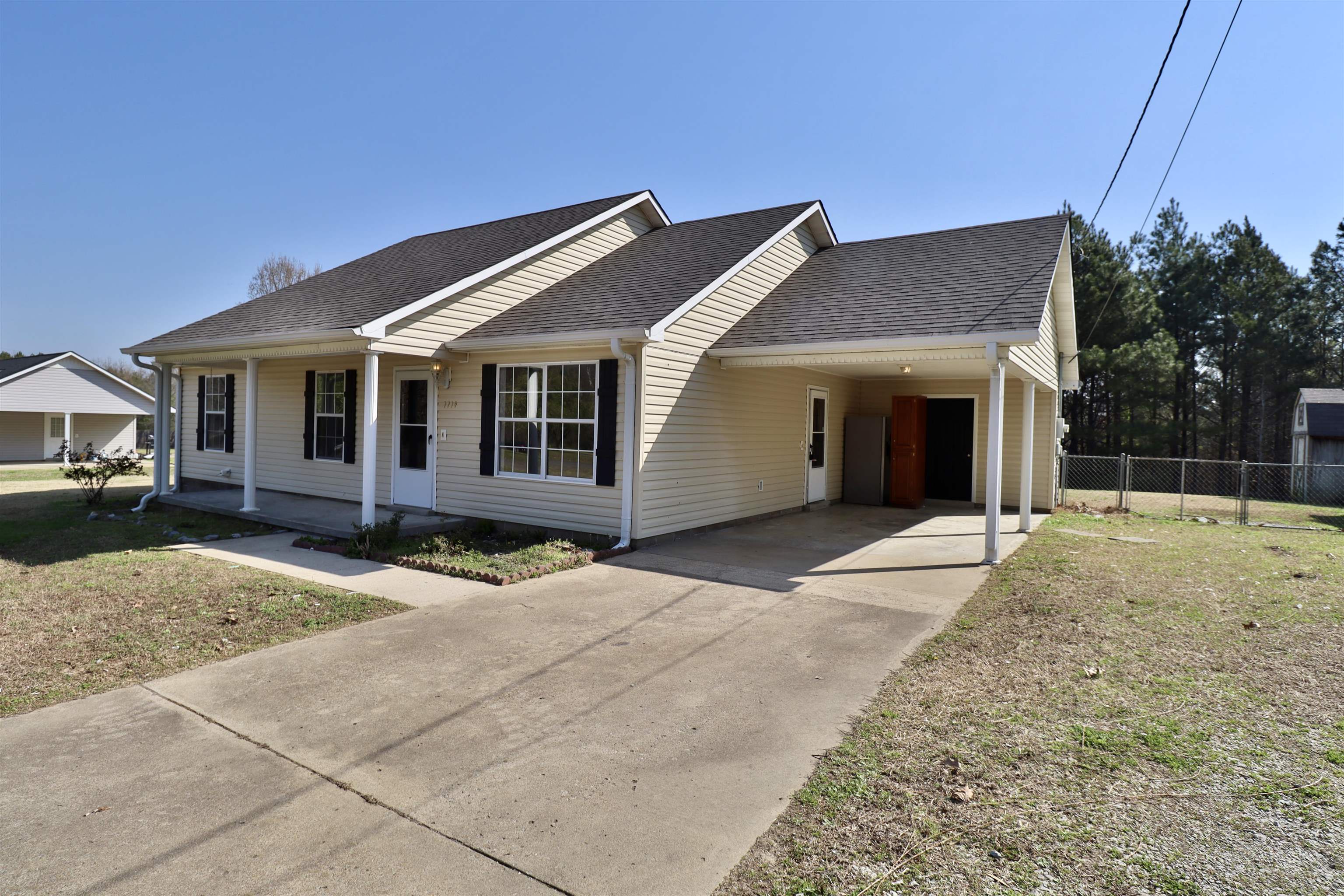 1714 Conner Whitefield Road Ripley, TN 38063 - Photo 22 of 37 a front view of a house with a yard and garage