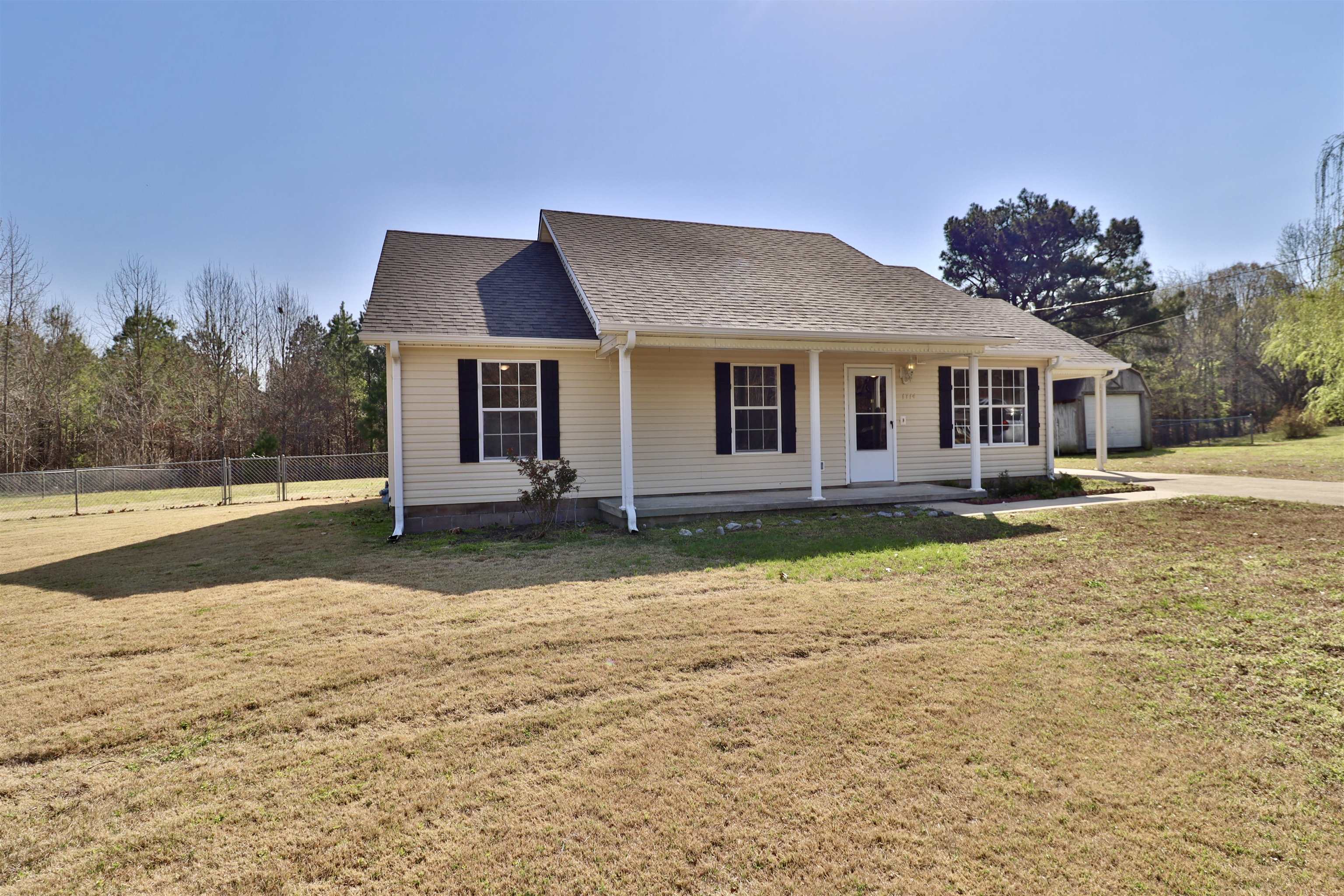 1714 Conner Whitefield Road Ripley, TN 38063 - Photo 26 of 37 a front view of a house with a yard