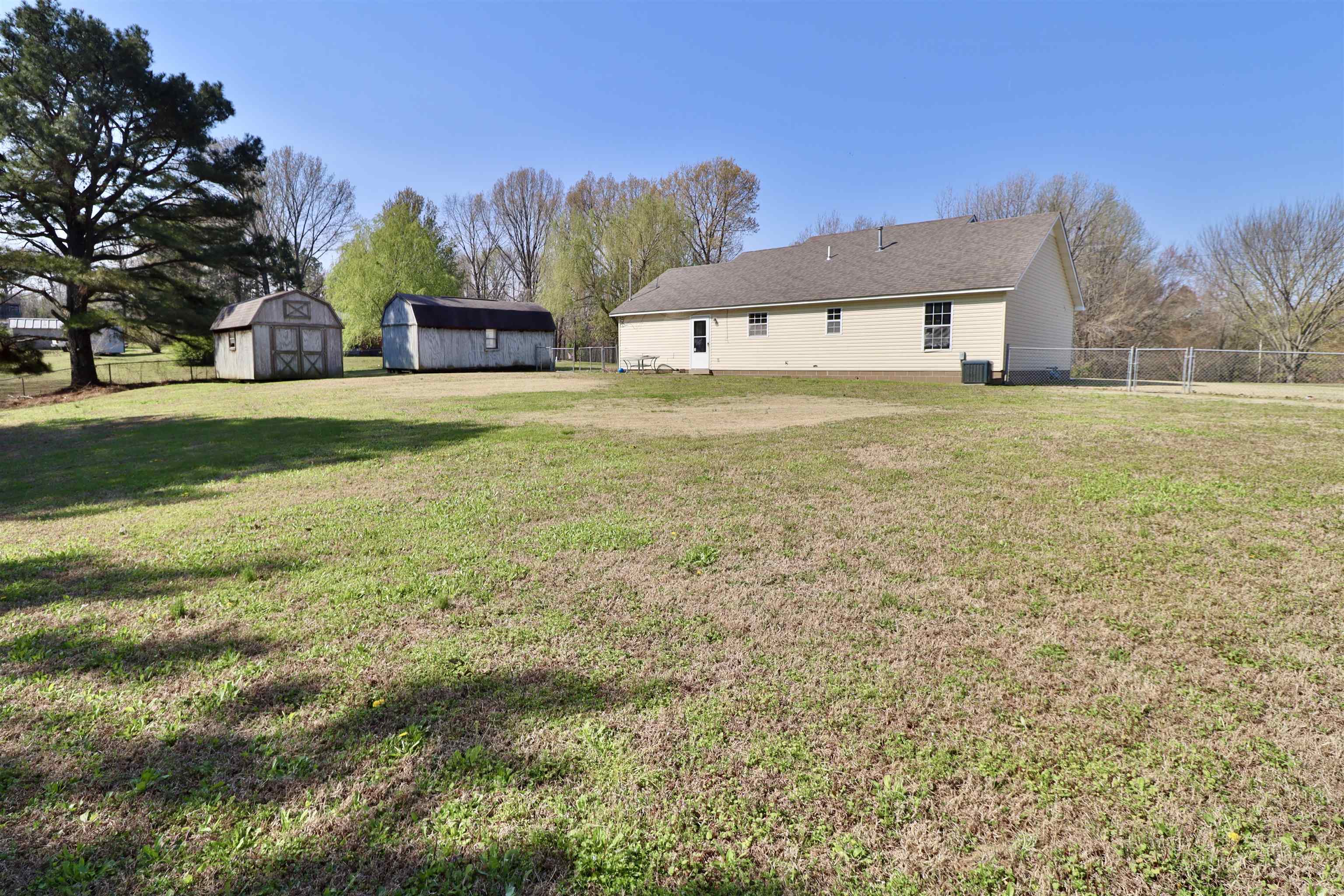 1714 Conner Whitefield Road Ripley, TN 38063 - Photo 27 of 37 a front view of a house with a yard