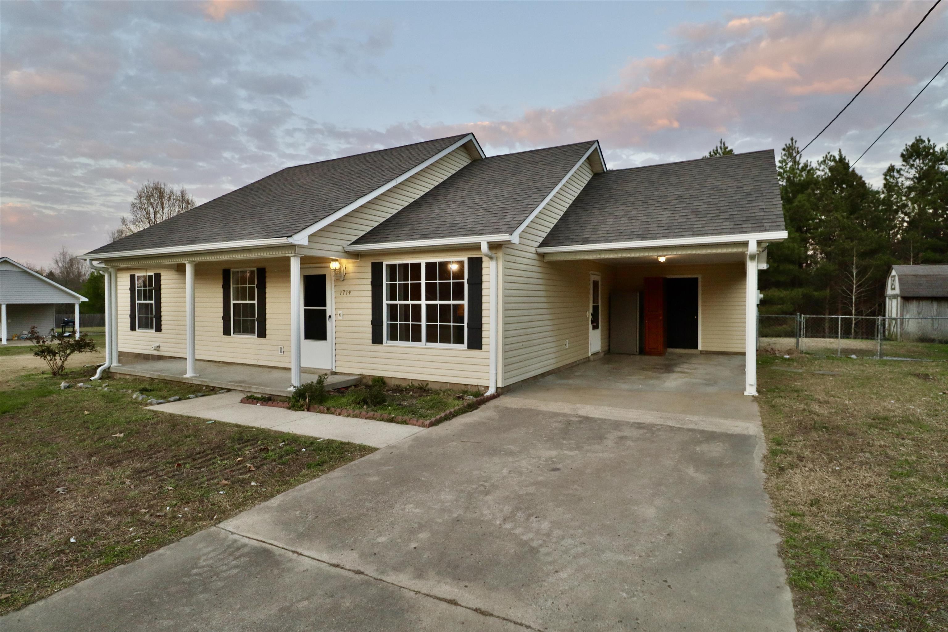 1714 Conner Whitefield Road Ripley, TN 38063 - Photo 31 of 37 front view of a house with a yard