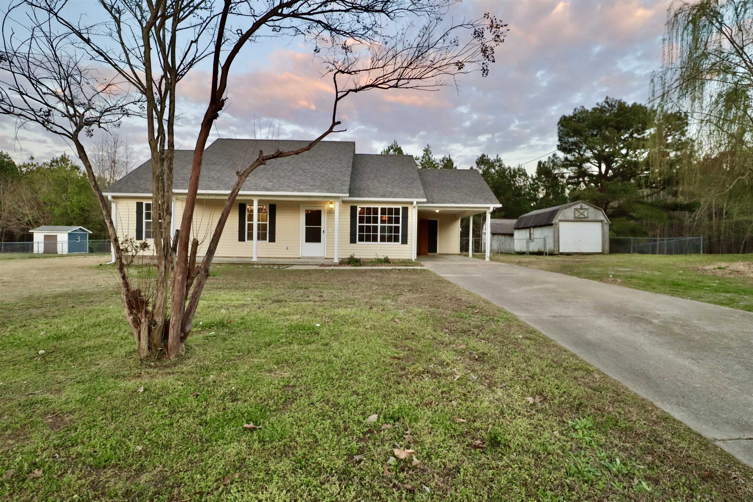 1714 Conner Whitefield Road Ripley, TN 38063 - Photo 32 of 37 a front view of a house with garden