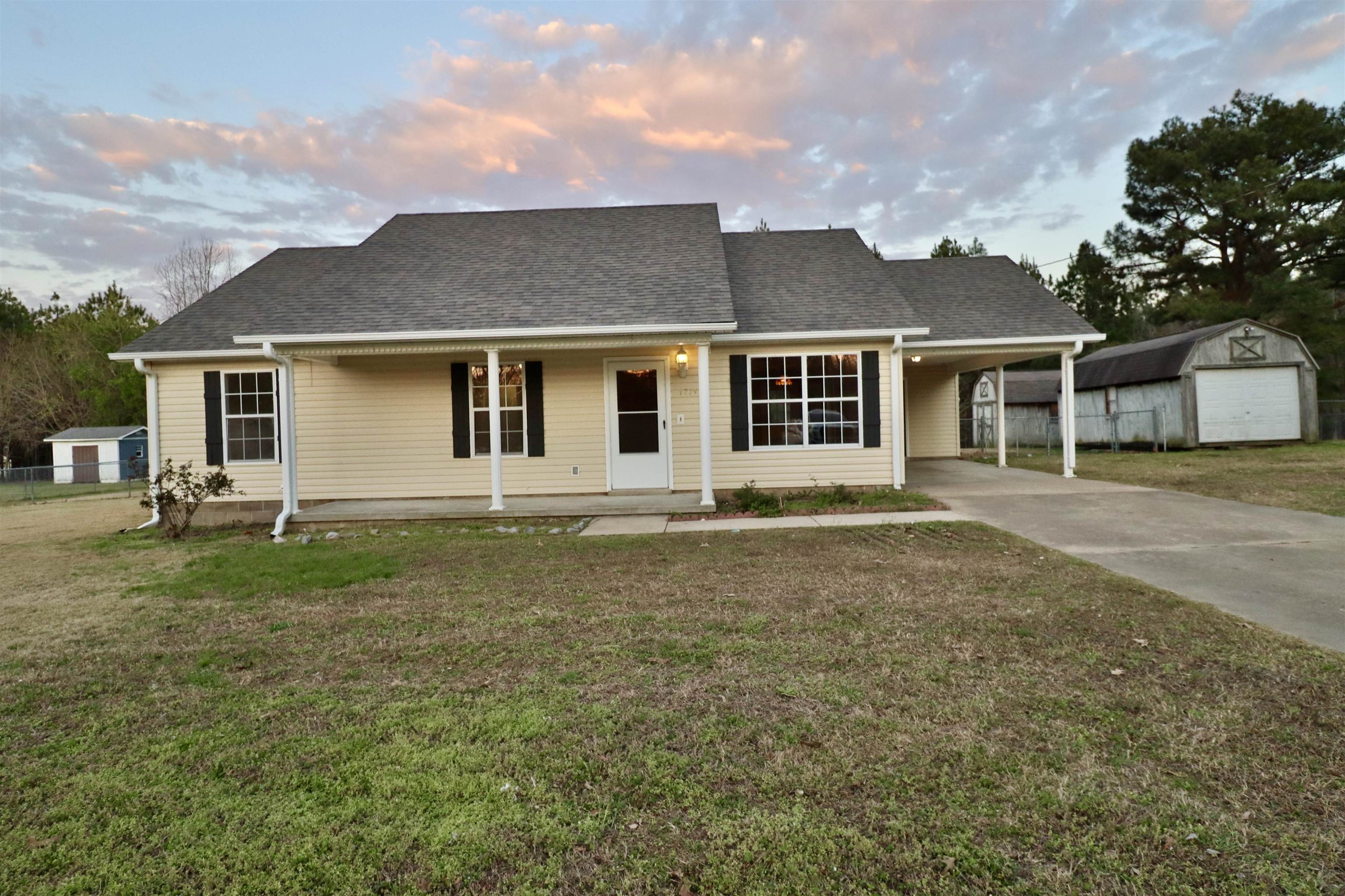 1714 Conner Whitefield Road Ripley, TN 38063 - Photo 33 of 37 front view of a house with a yard
