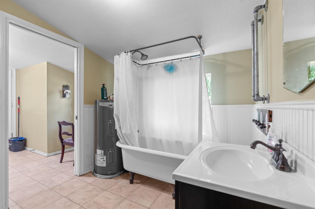 1355 North Houston Street Lorena, TX 76655 - Photo 28 of 40 a bathroom with a sink and a mirror