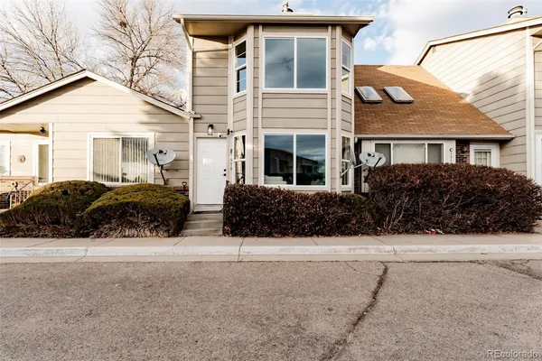 a view of multiple house with a yard