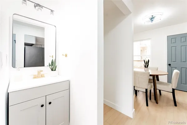 a en suite bathroom with a sink and a mirror