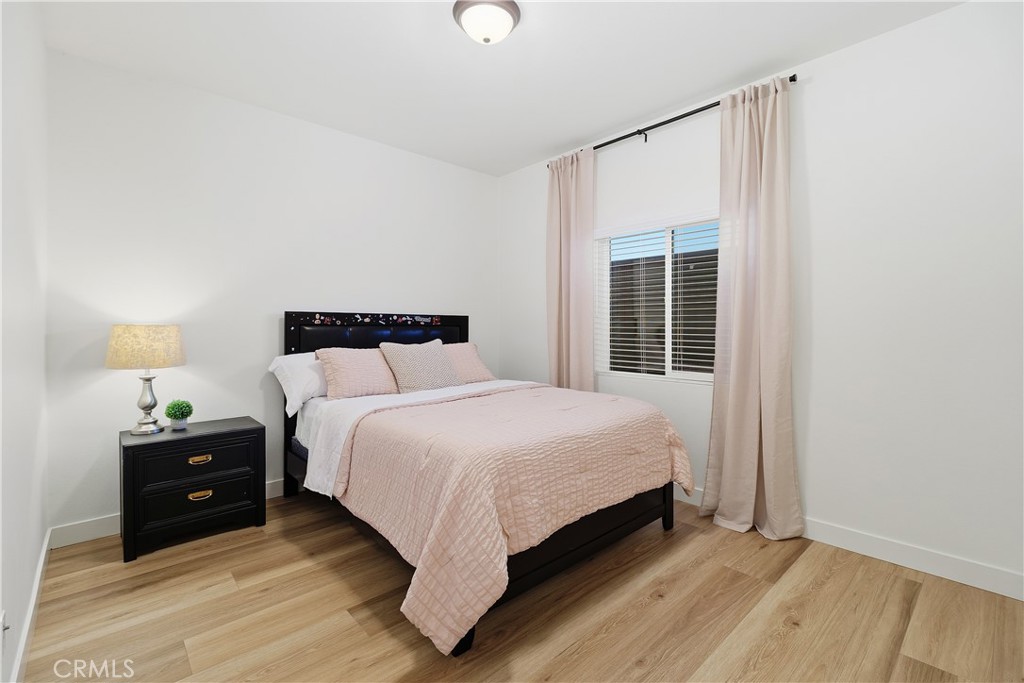 34727 Ribbon Grass Way Murrieta, CA 92563 - Photo 11 of 54 Secondary bedroom on main level with designer hardware and linen drapes